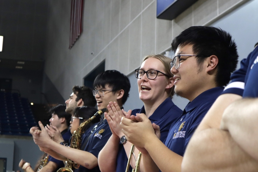 People clap for the players.