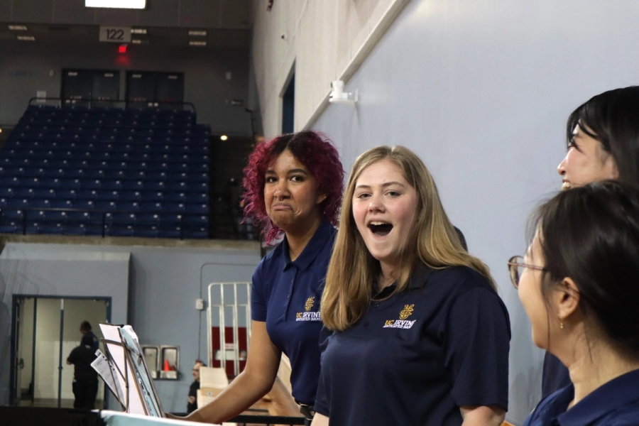 Two flute girls making weird faces.