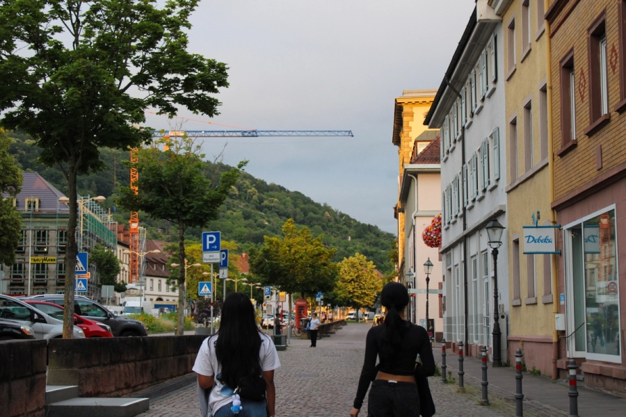 Walking POV of two girls on the sidewalk.
