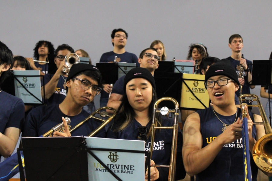 Three trombones wearing beanies.