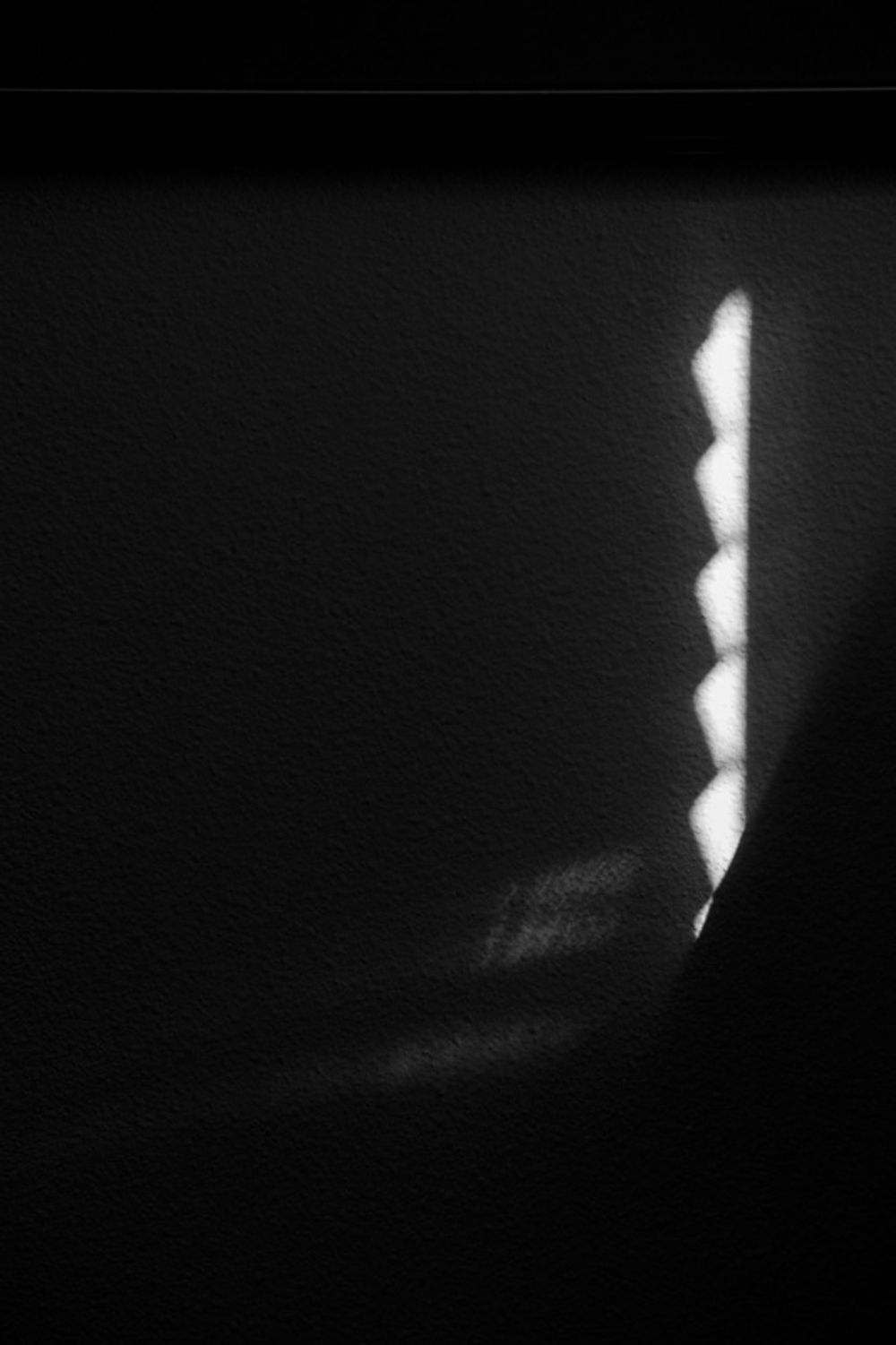 Some light appearing on a wall.