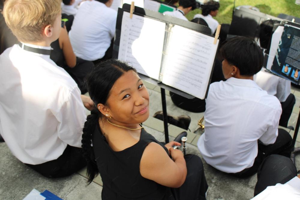 Girl in band posing.