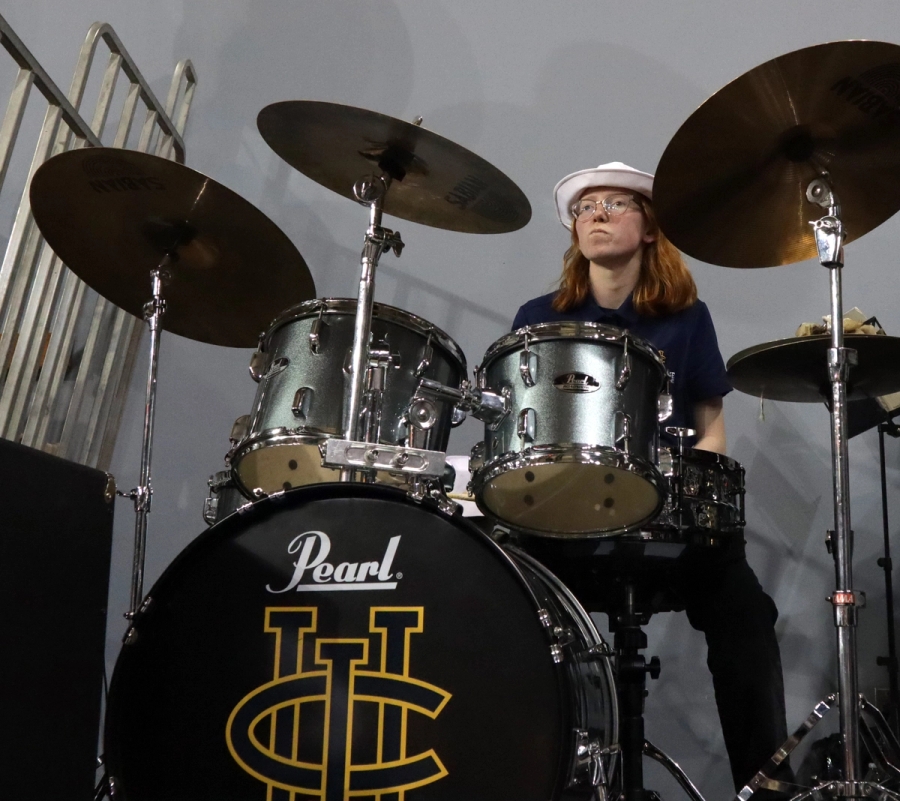 Girl playing the drums.