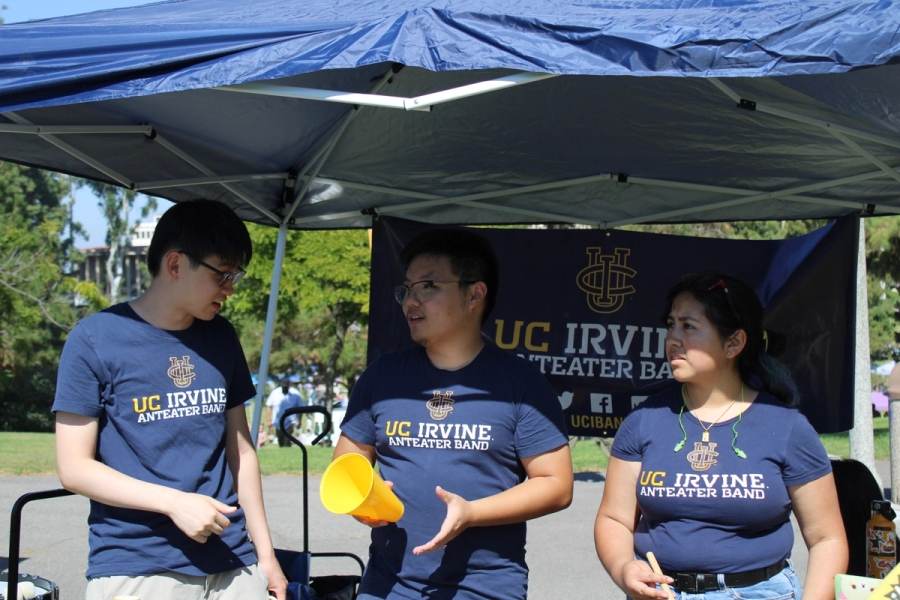 Students talking under canopy.
