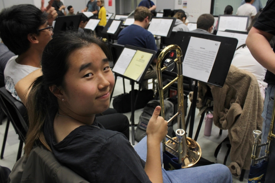 Girl posing with trombone.