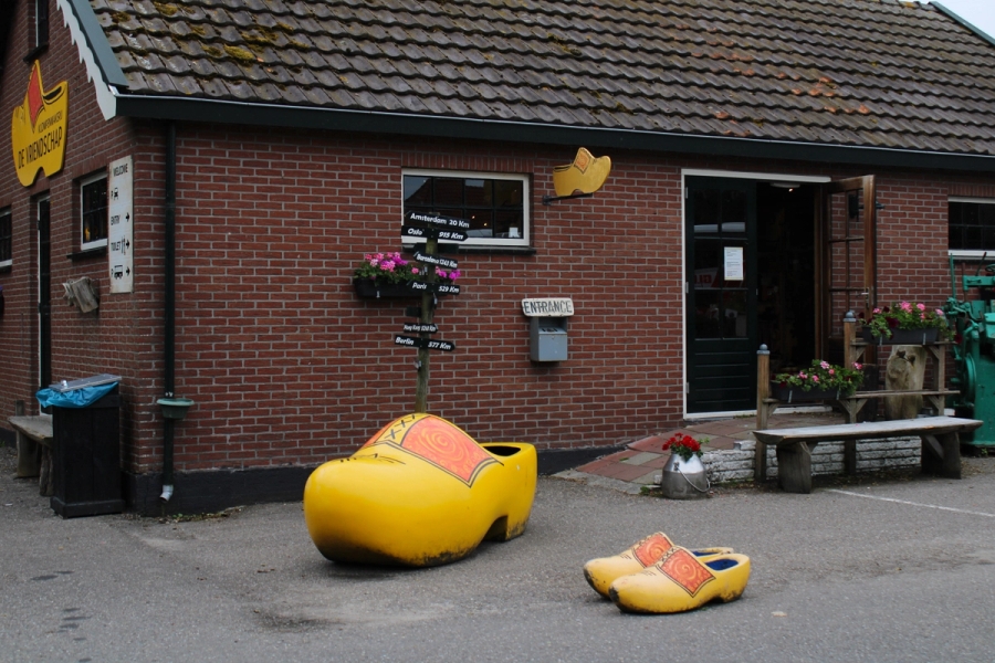 Huge clog in front of brick building.