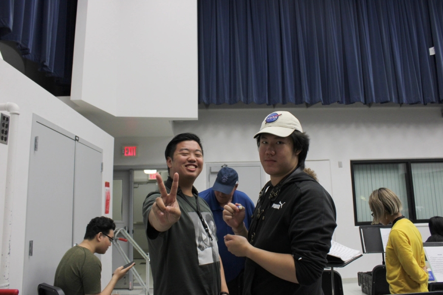 Two boys pose.