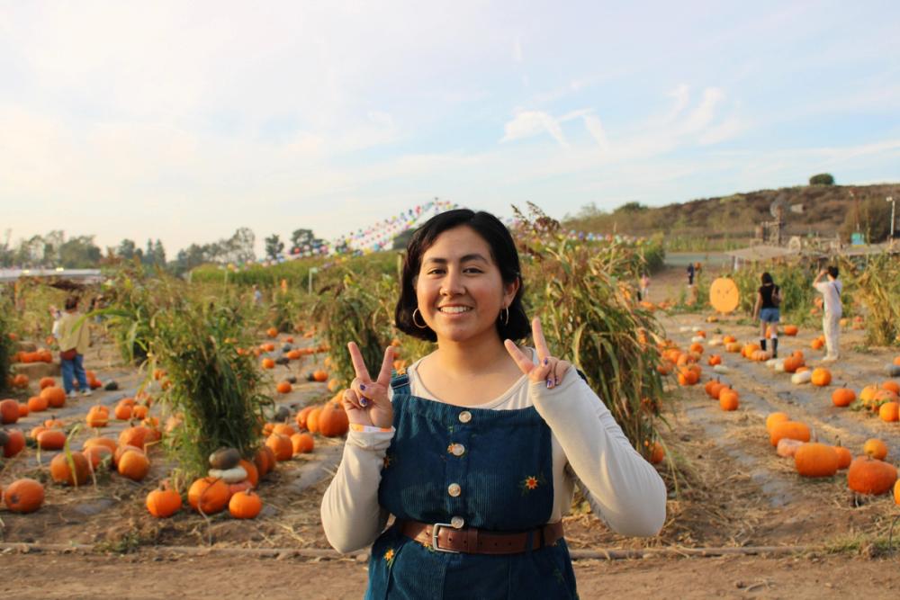 Girl posing with peace signs.