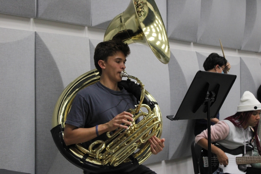 Boy playing tuba.
