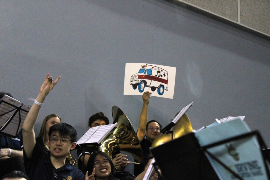 Man holding a "Wambulance" sign.