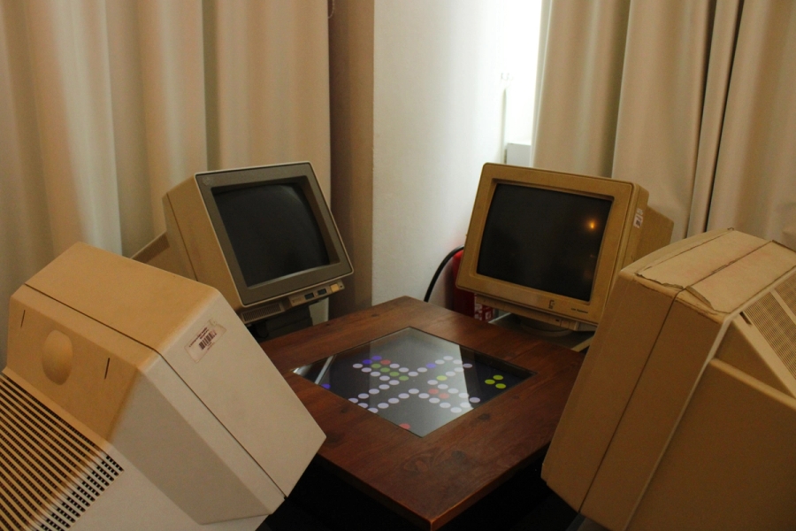 Four old desktops looking at each other.