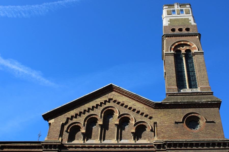 Brick building with tower.