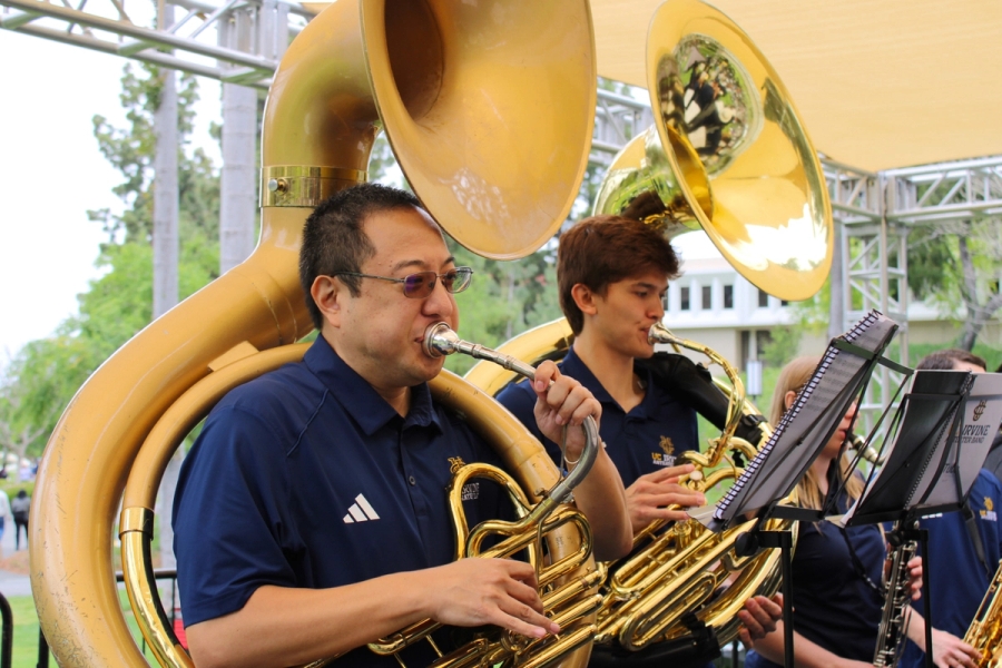 Side POV of tubas playing.