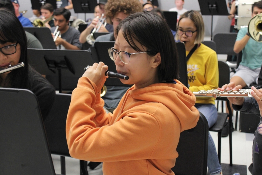 Girl playing the piccolo.