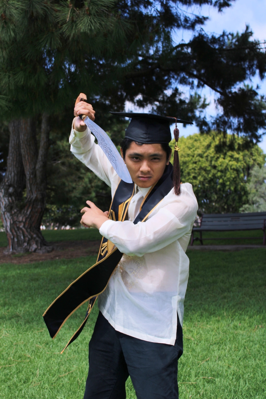 Man in Filipino stole and cap with medium sword 2.