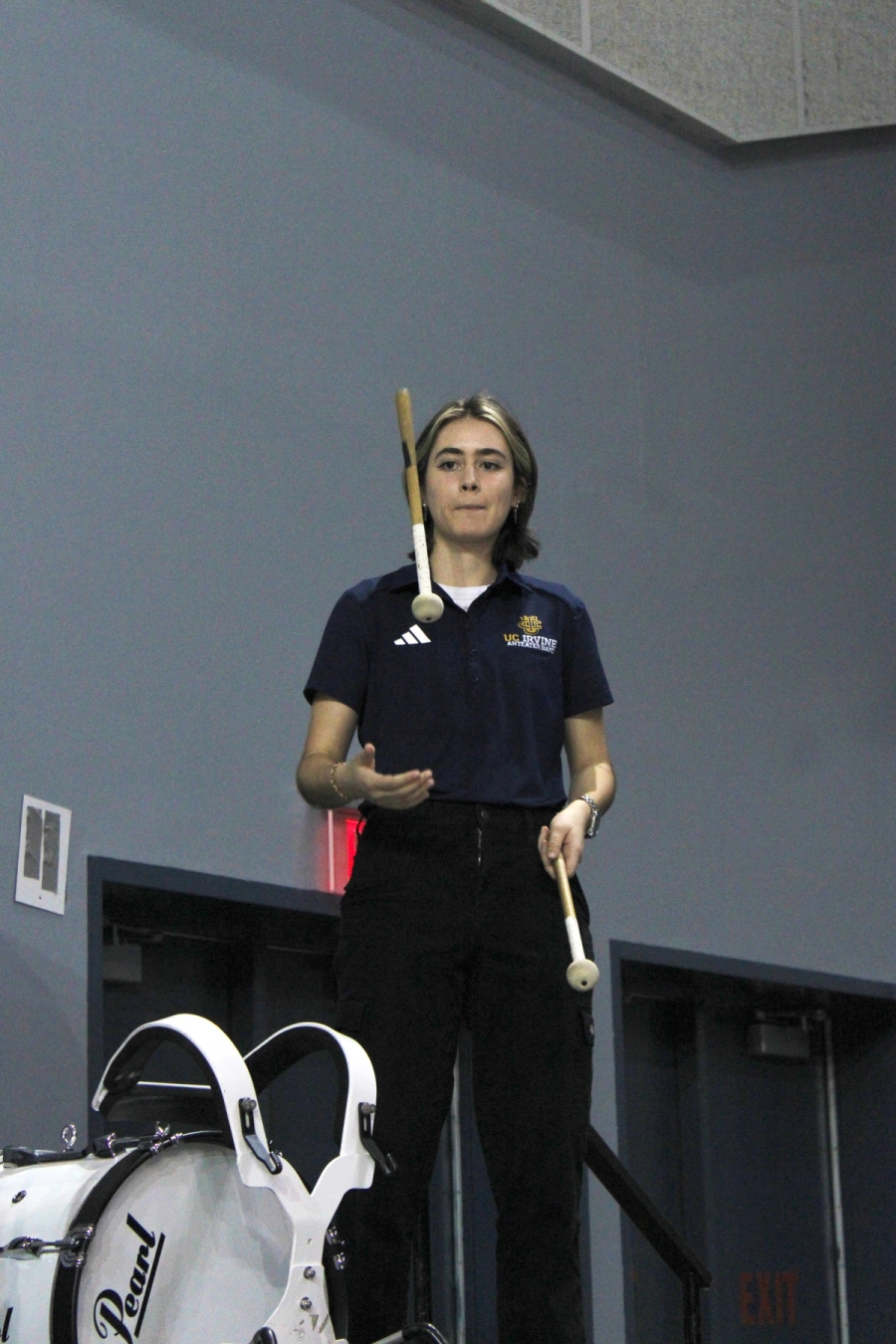 Girl flipping a mallet.