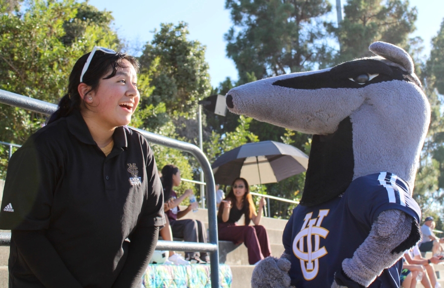 Girl laughing at Peter the Anteater.