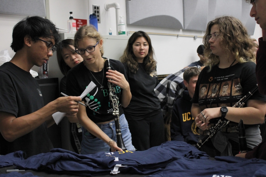 Manager giving out band shirts.
