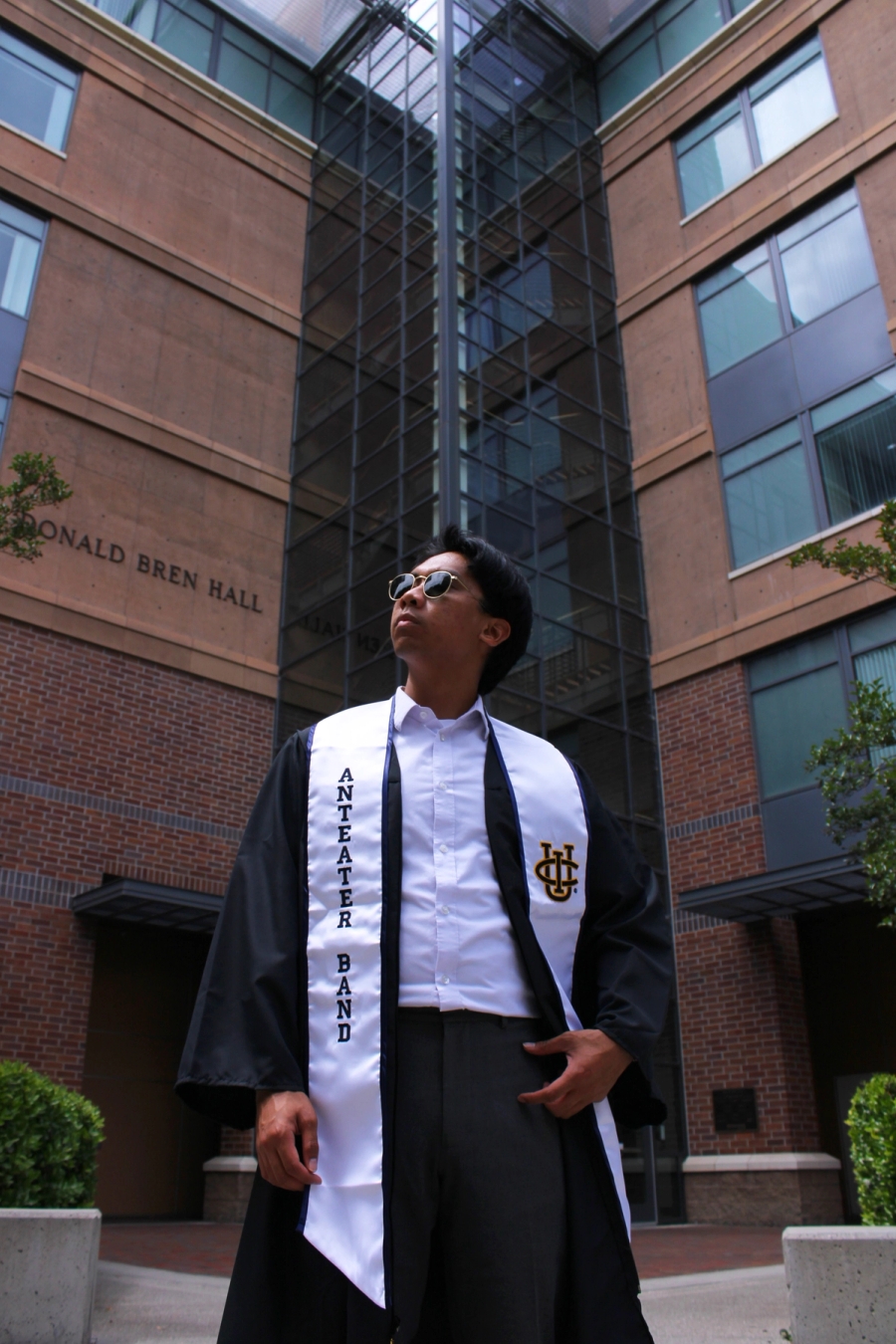 Low angle of boy in grad fit.
