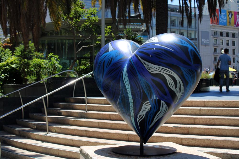 Heart sculpture at bottom of stairs.