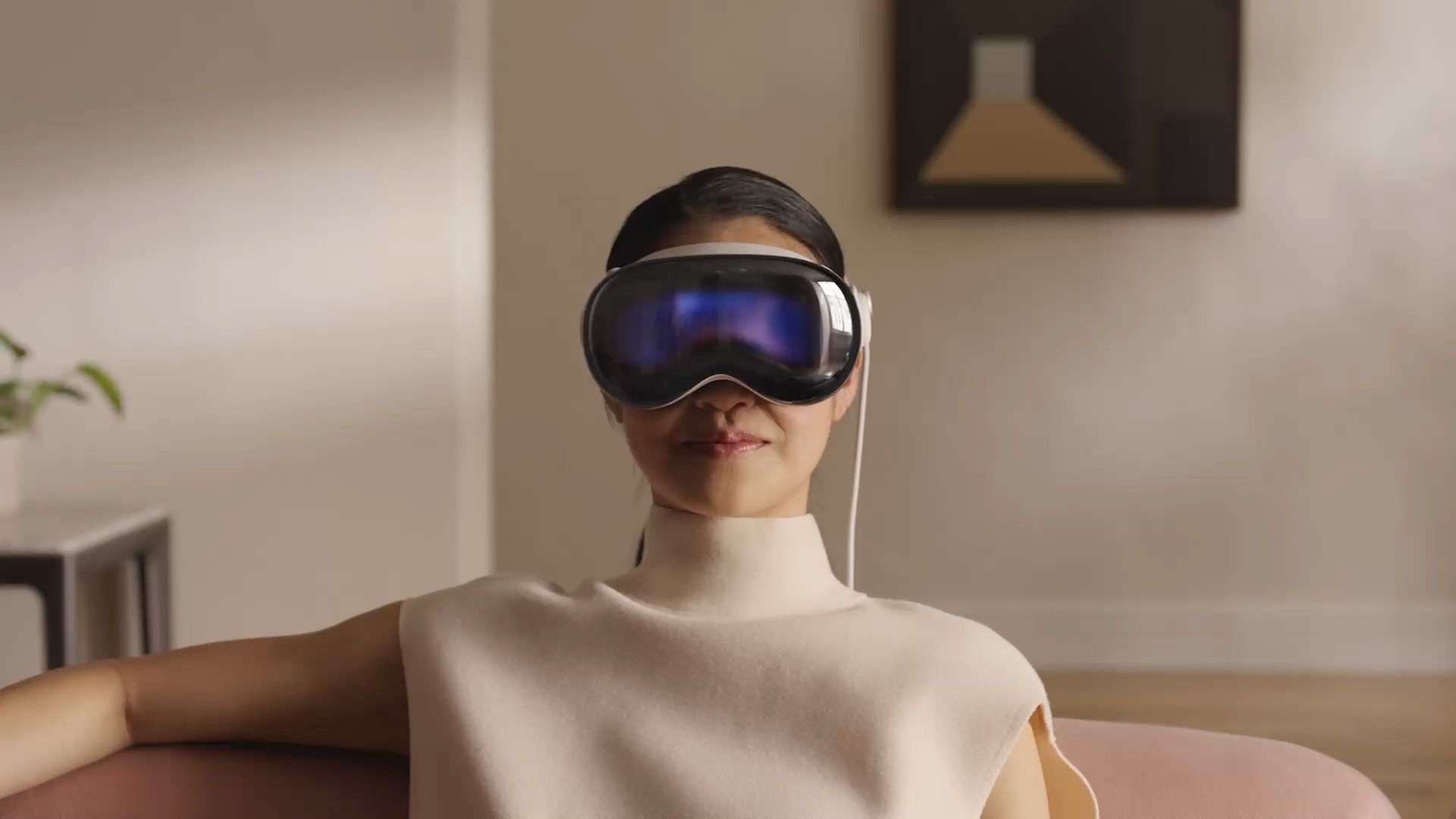 A woman wearing an Apple Pro Vision headset