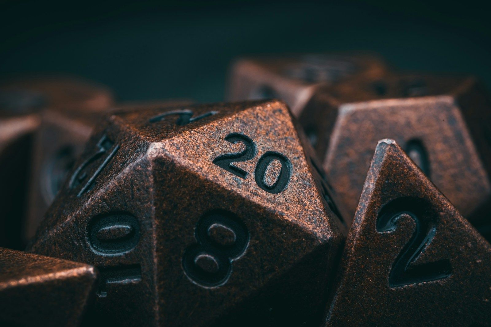 Metal gaming dice on a table — the planning side of RPG theorycrafting