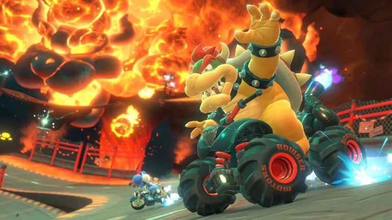 Mario Kart World: Bowser drives a monster truck past glowing lava and fireballs at night.