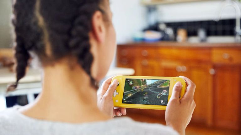 Someone playing a Nintendo Switch Lite