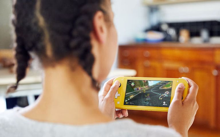 Someone playing a Nintendo Switch Lite