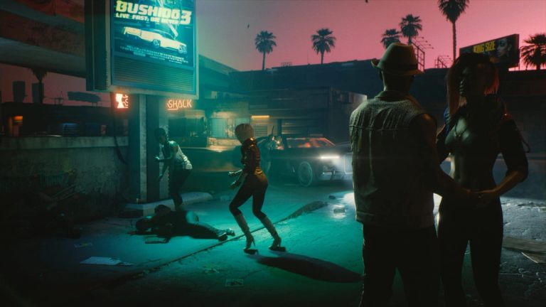 Two figures stand on a neon-lit street at dusk as others cross nearby.