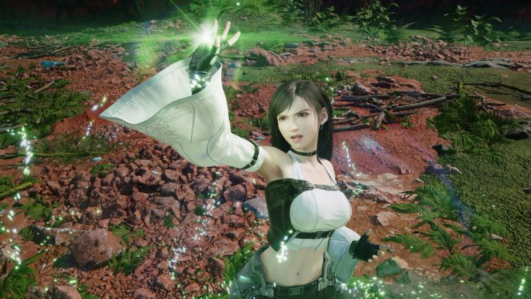 A woman raises a glowing hand in a rocky outdoor setting.