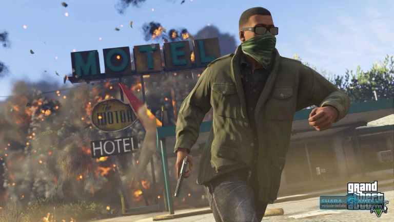 A masked man with a pistol runs past a motel as an explosion erupts behind him.