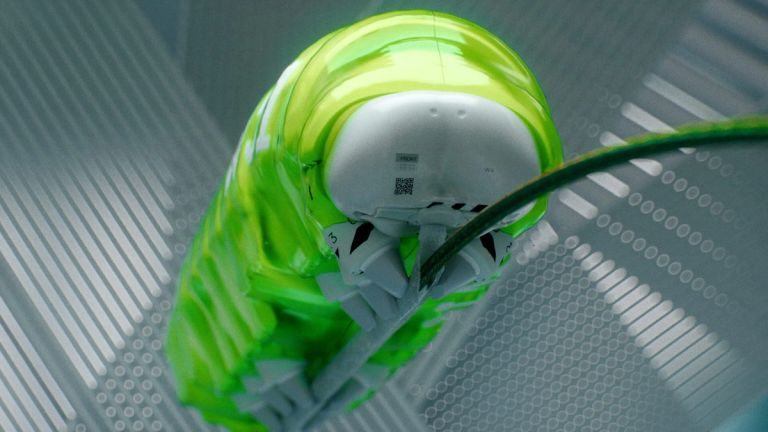 Marathon: A white helmet and suit lie beneath a translucent neon-green covering on a patterned floor.