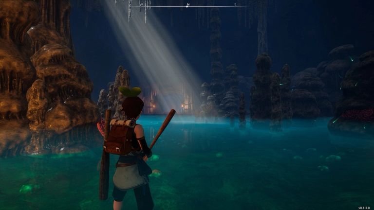 Palworld: A player stands in a glowing underground pool surrounded by stalagmites and cave walls.