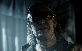A creepy-looking figure in a mask in Resident Evil Requiem