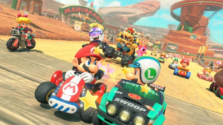 Mario Kart World: Mario and Luigi race side by side on a desert track with Bowser and other racers behind.