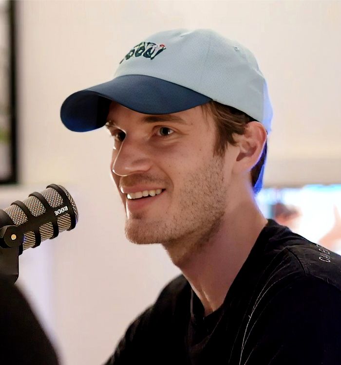 PewDiePie (Felix Kjellberg) smiling in front of a microphone on the Cold Ones podcast, July 2019