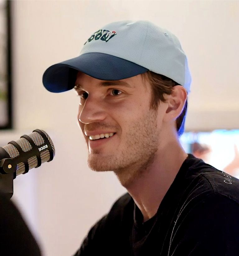 PewDiePie (Felix Kjellberg) smiling in front of a microphone on the Cold Ones podcast, July 2019