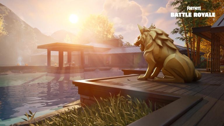 Fortnite: A golden wolf statue sits on a wooden deck beside a pool at sunset.
