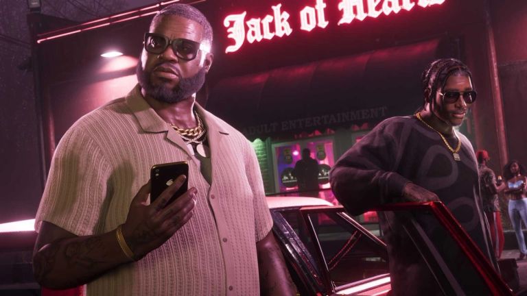 Grand Theft Auto VI: Two men in sunglasses stand by a car beneath a glowing Jack of Hearts sign.