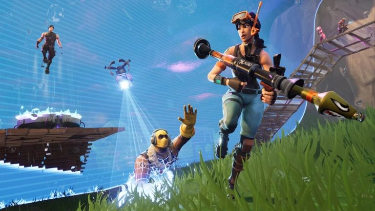 Fortnite: A woman with a launcher stands beside the blue storm wall as a masked character reaches up.