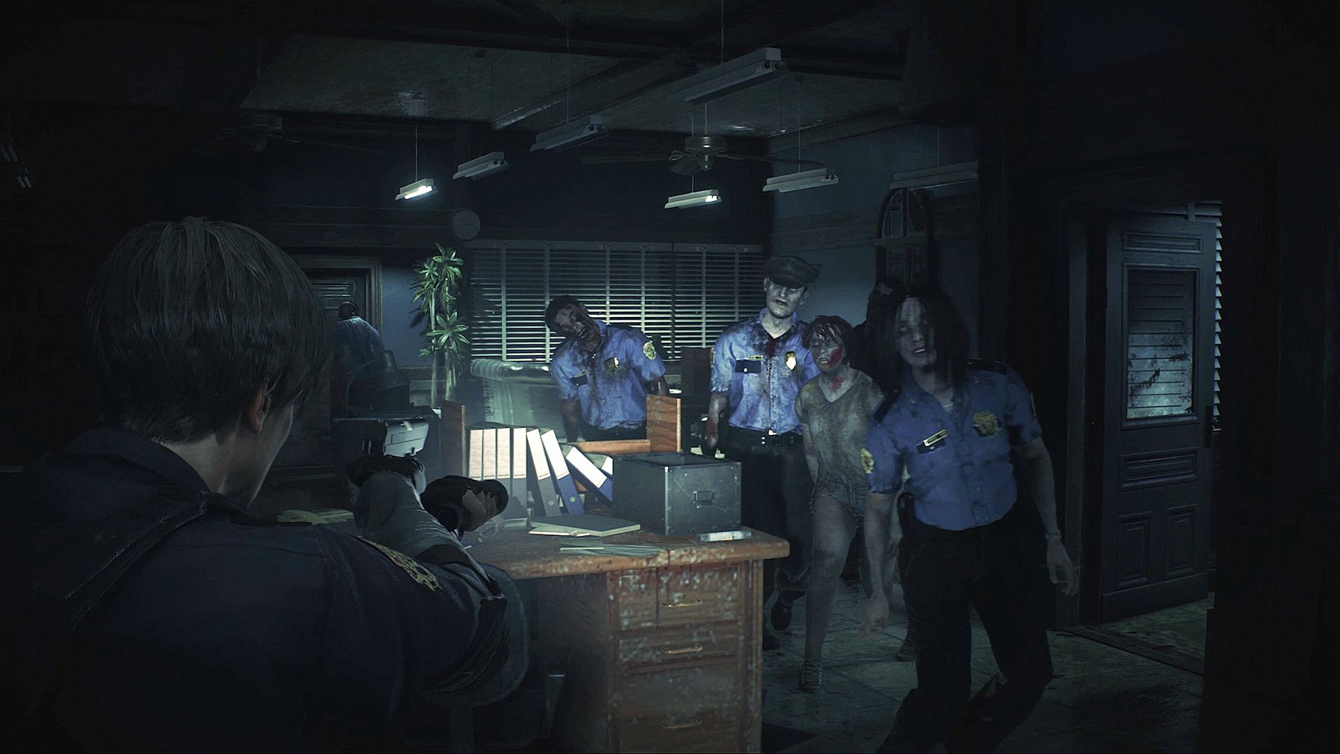 Leon looking at some zombies in Resident Evil 2