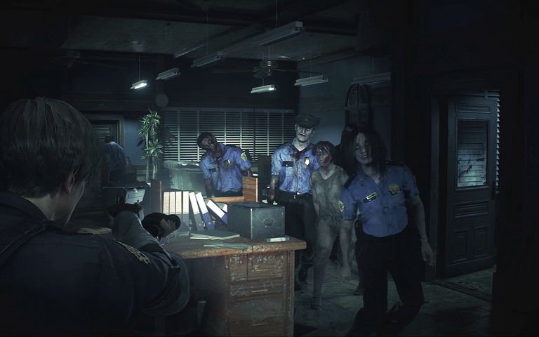 Leon looking at some zombies in Resident Evil 2