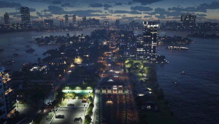 Grand Theft Auto VI: An aerial view of a waterfront road, boats, and illuminated buildings at dusk.