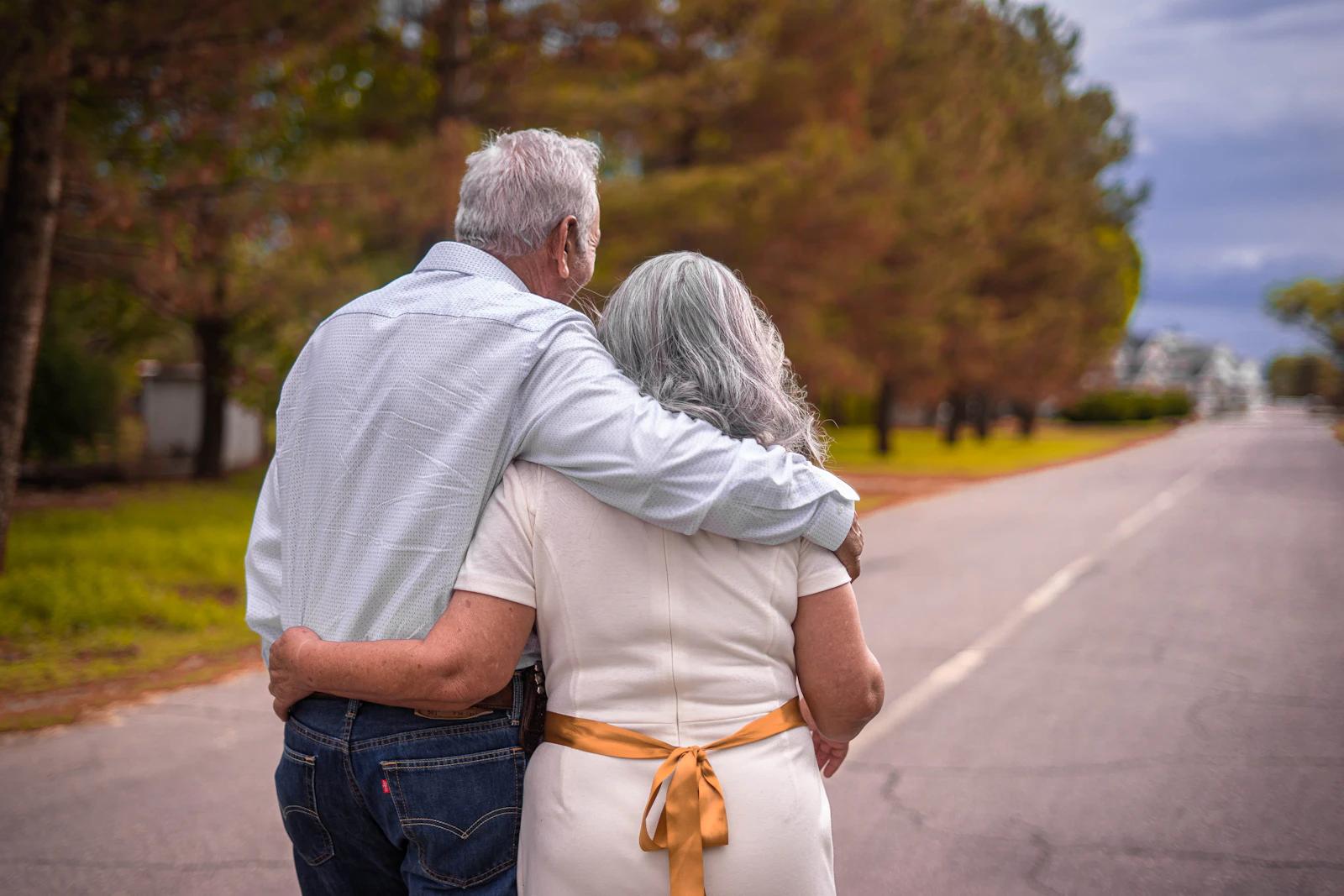 Older couple walking together outdoors