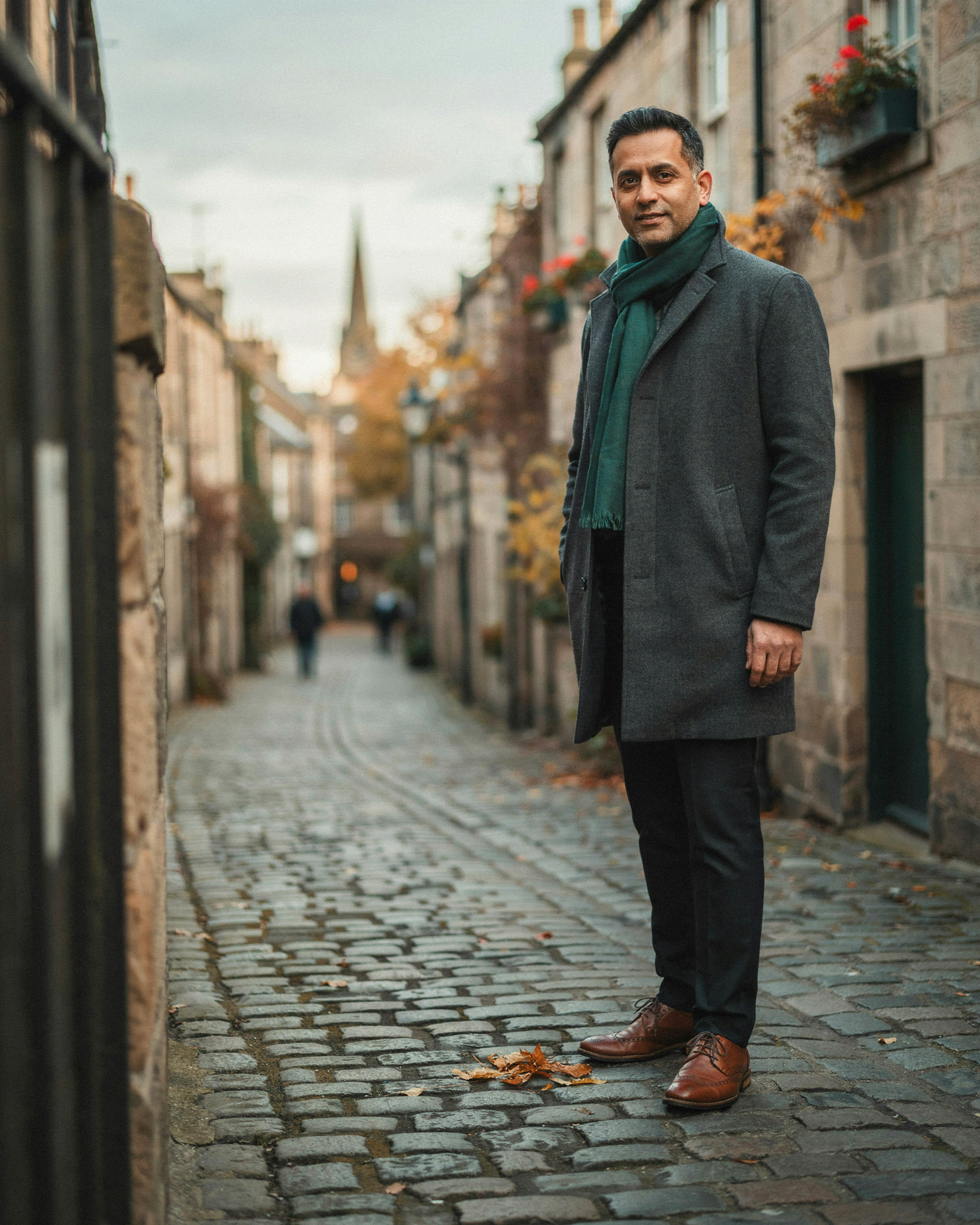 Adult walking down Circus Lane in Stockbridge, Edinburgh, in autumn, with protection from an updated COVID-19 vaccine building over the following weeks
