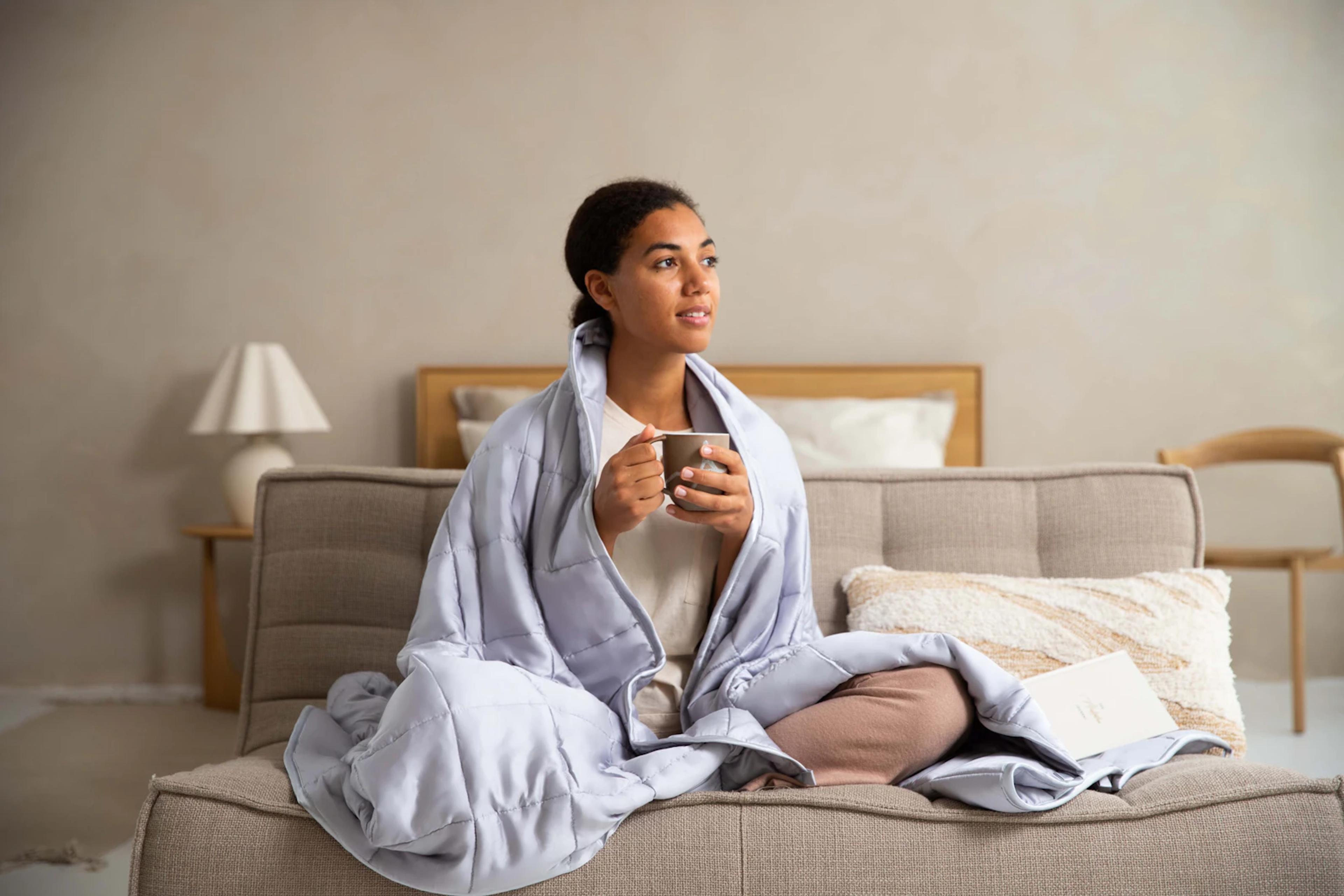 Woman resting at home with a cup of tea