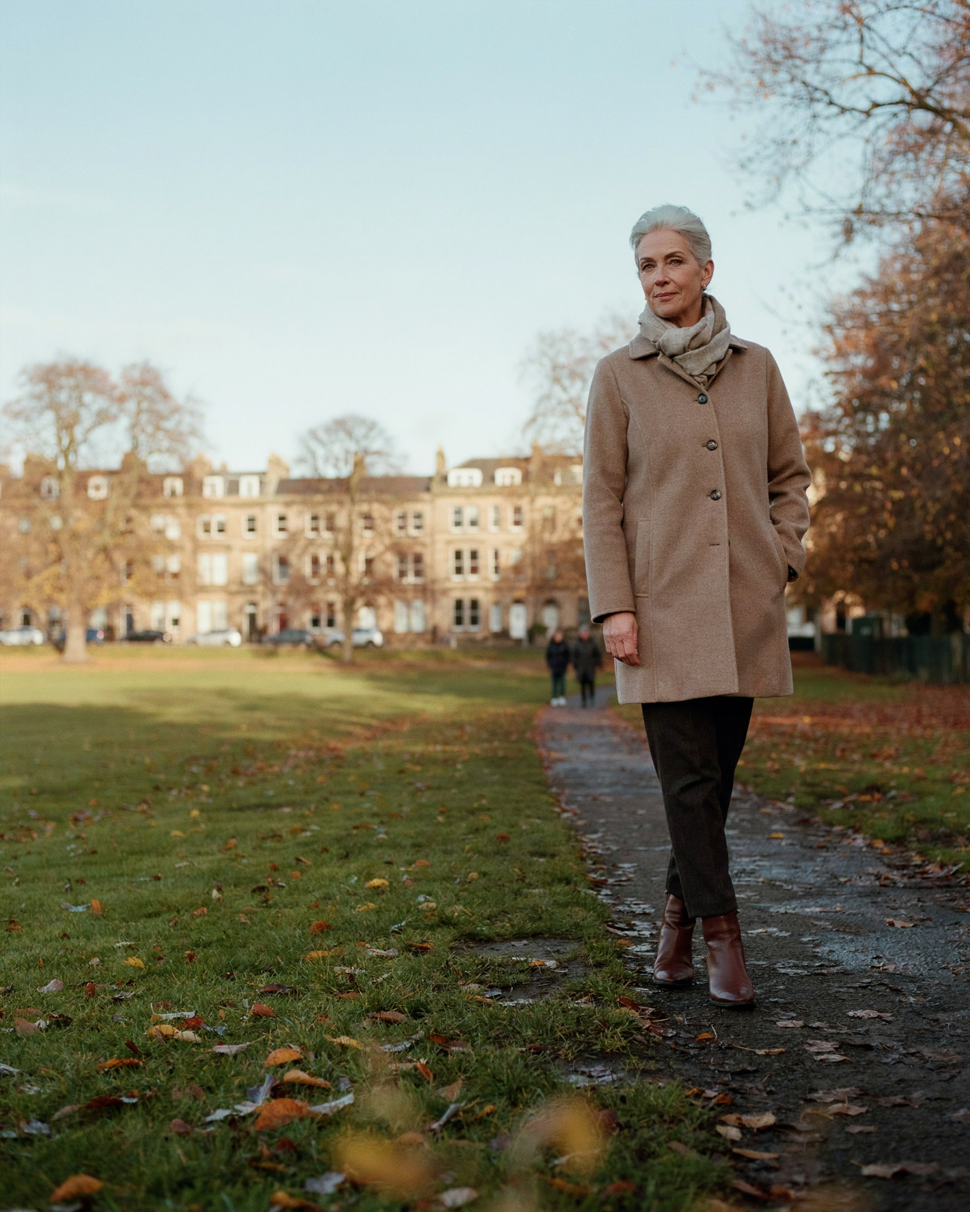 Adult walking across Bruntsfield Links in Edinburgh on a crisp autumn morning, the start of flu vaccination season