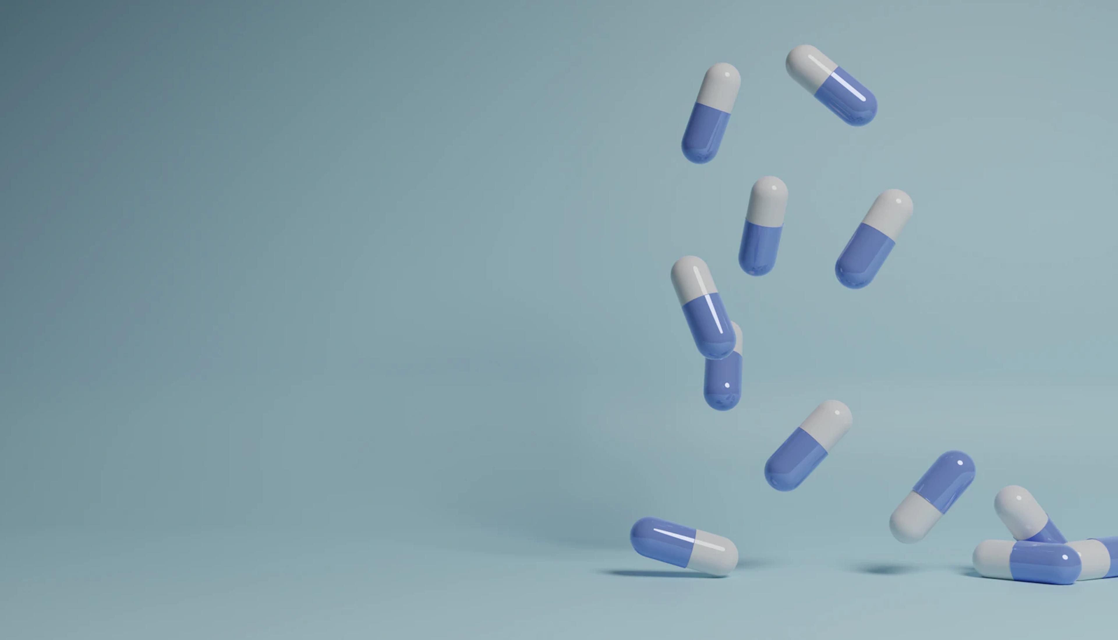 Capsules on a pale blue background
