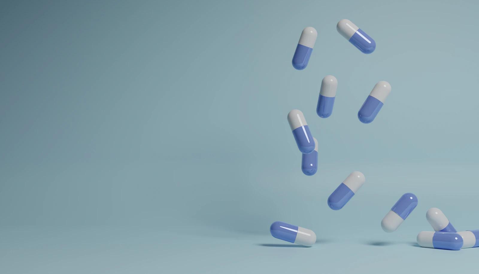 Capsules on a pale blue background